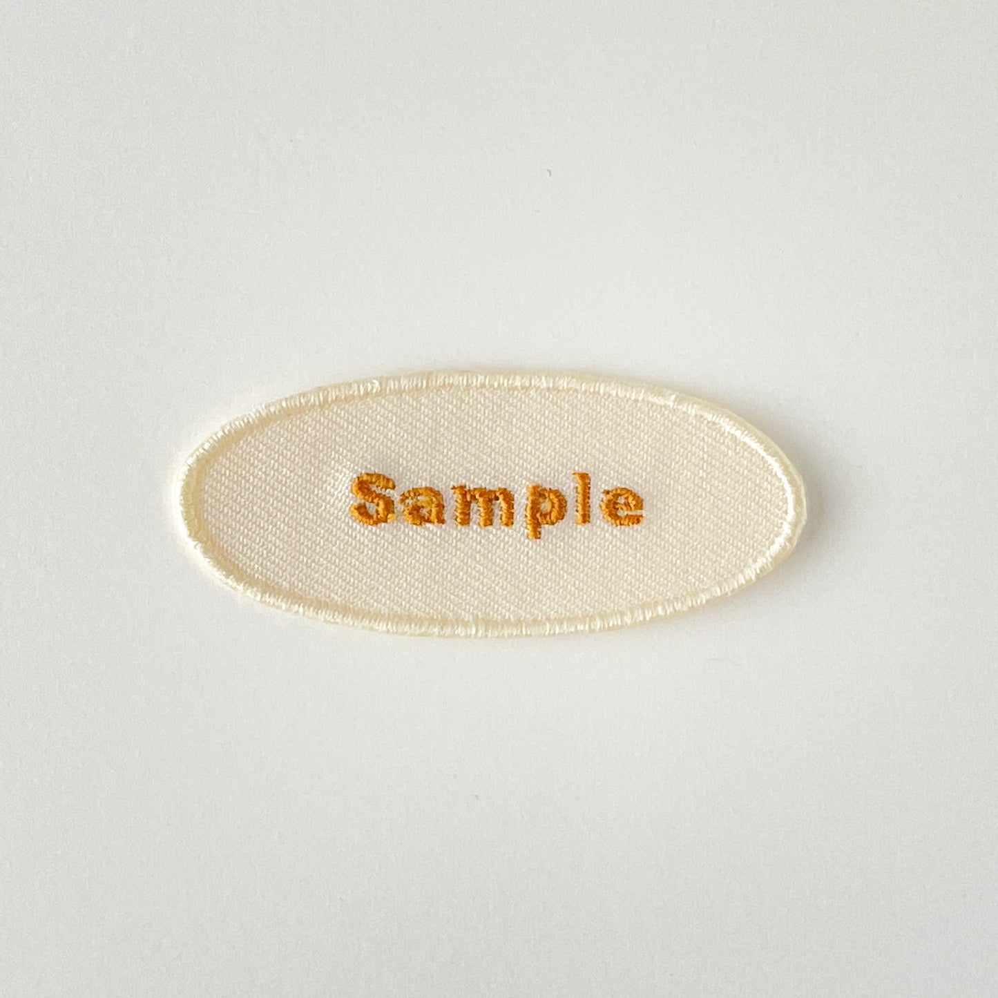 刺繍ネームワッペン/Mサイズ(約60mm)/シール・アイロン接着/楕円型/シンプルゴールド/3枚セット