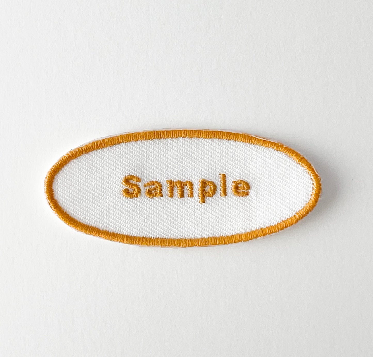 刺繍ネームワッペン／Mサイズ（約60mm）／シール・アイロン接着／楕円型／シンプルゴールド／3枚セット