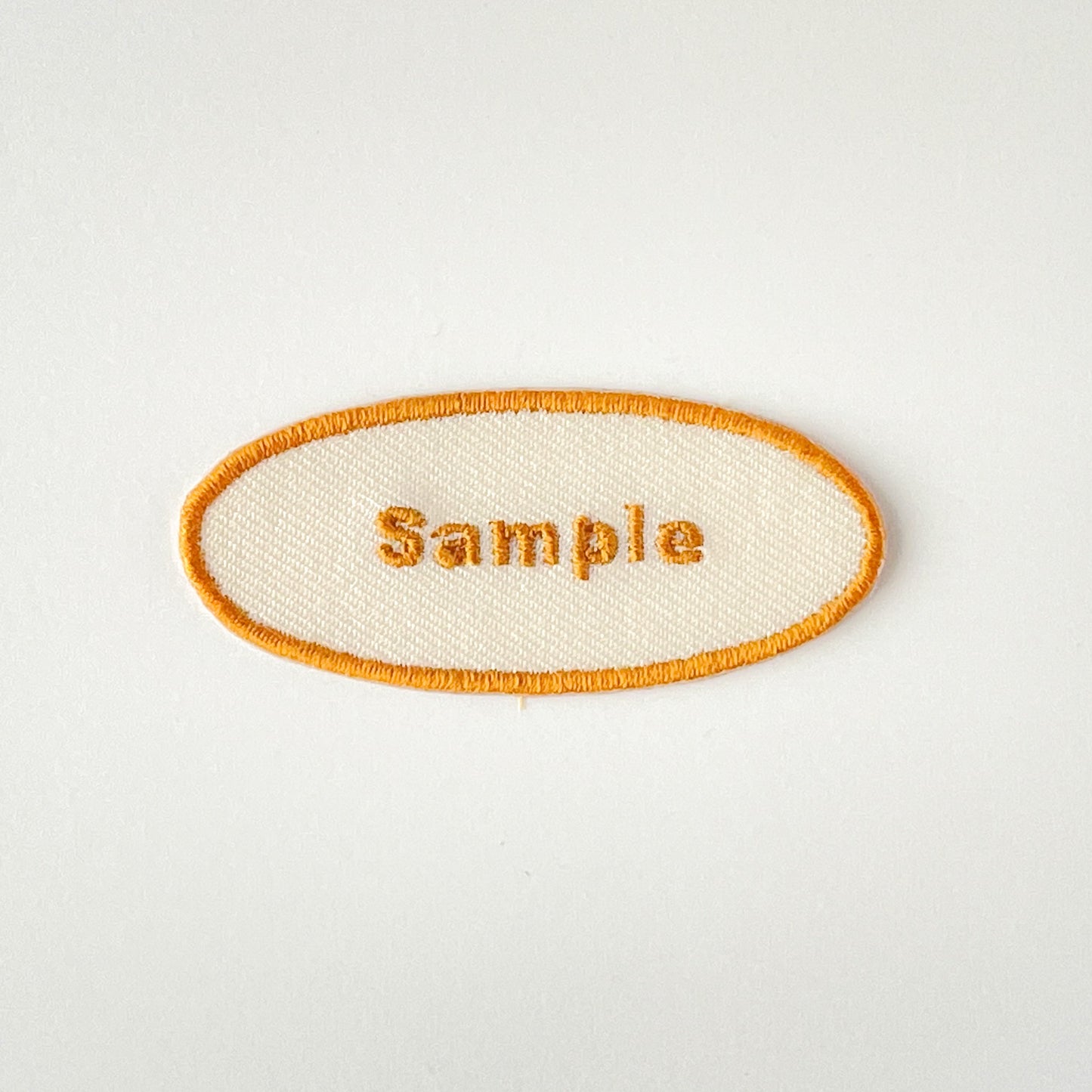 刺繍ネームワッペン／Mサイズ（約60mm）／シール・アイロン接着／楕円型／シンプルゴールド／3枚セット